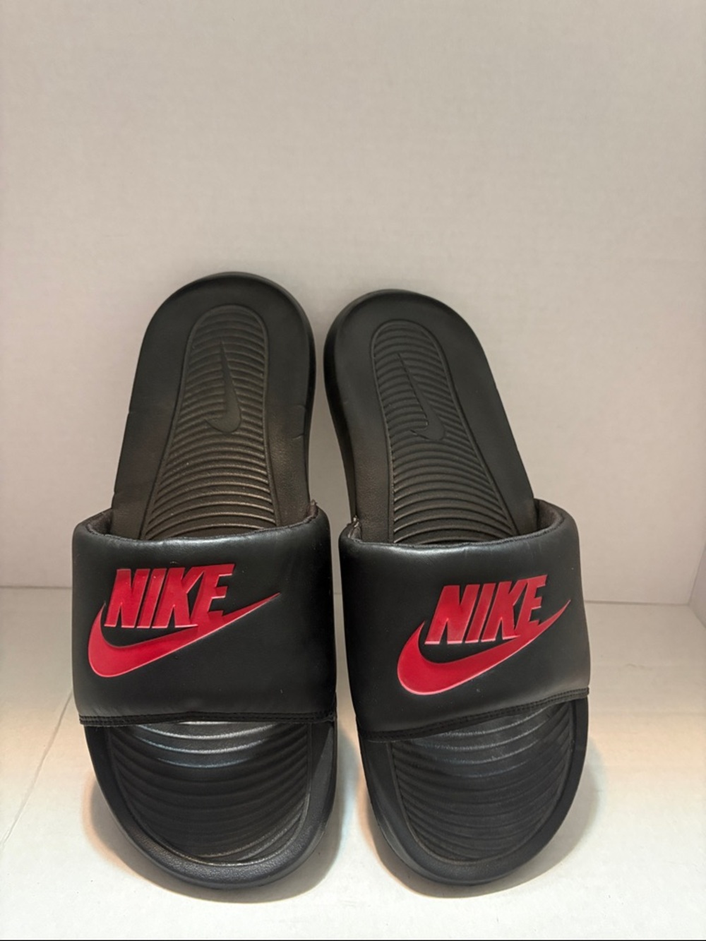 Nike Black Slides with Red Logo Accent